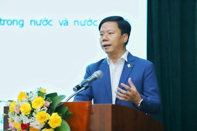 &Ocirc;ng Nguyễn Quang Minh - Tổng Gi&aacute;m đốc C&ocirc;ng ty Cổ phần Thanh to&aacute;n Quốc gia Việt Nam (NAPAS) - tr&igrave;nh b&agrave;y tham luận. Ảnh: T&ocirc; Thế